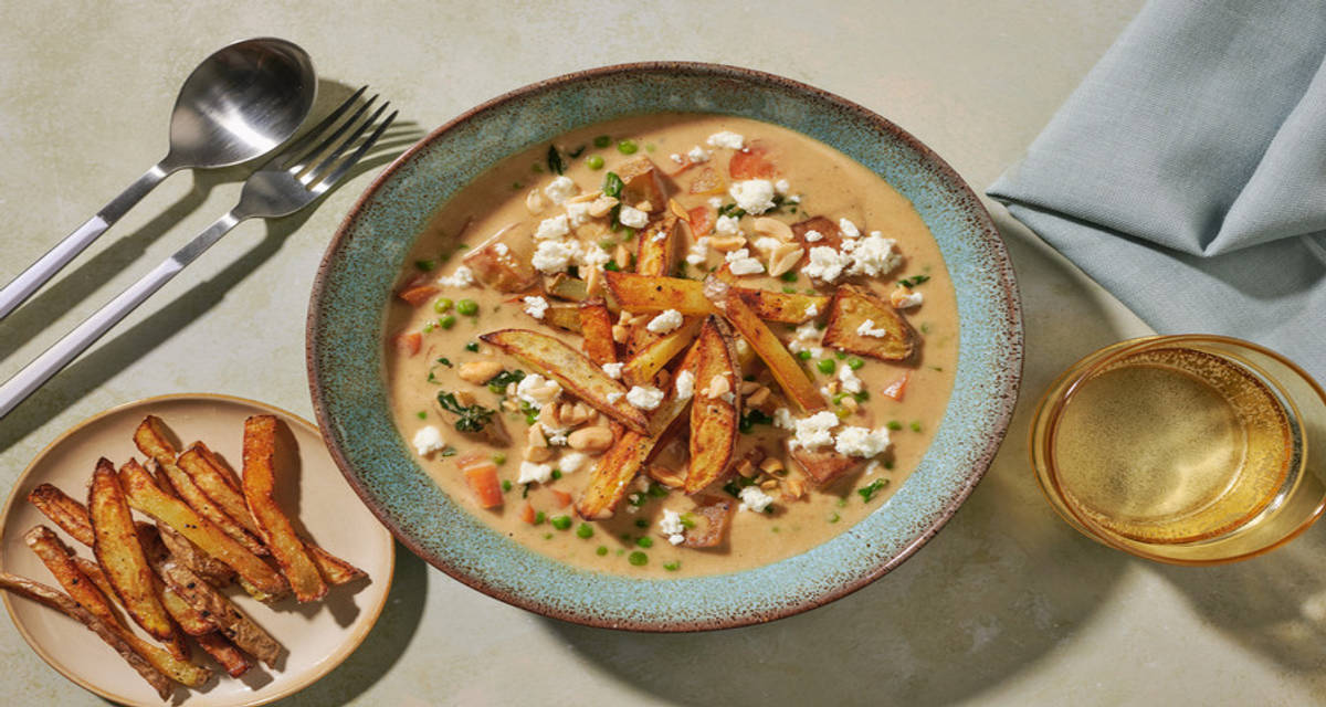 Bolivian Sopa de Mani Inspired Peanut Soup with feta and traditional potato garnish