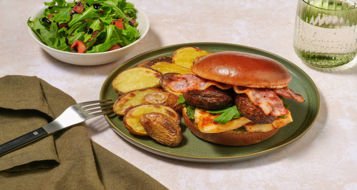 Glazed Halloumi and Portobello Mushroom Burger with Irish Bacon with pesto, baby potatoes and balsamic dressed salad