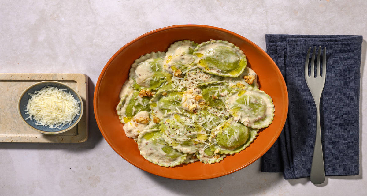 Ravioli di zucchine trombetta in salsa di noci con Parmigiano Reggiano Dop e panna