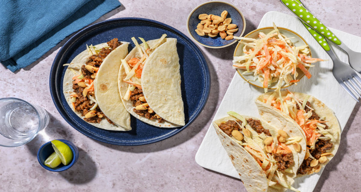 Zesty Asian Pork Tacos with crunchy peanuts and slaw