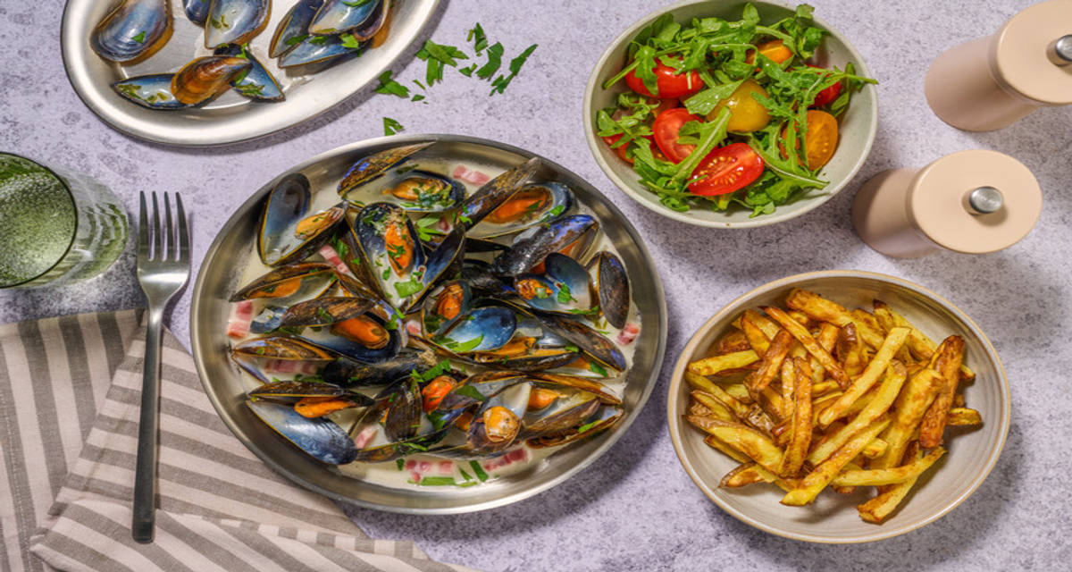 Lemon, Parsley and White Wine Moules Frites with Irish Bacon with rainbow cherry tomato salad