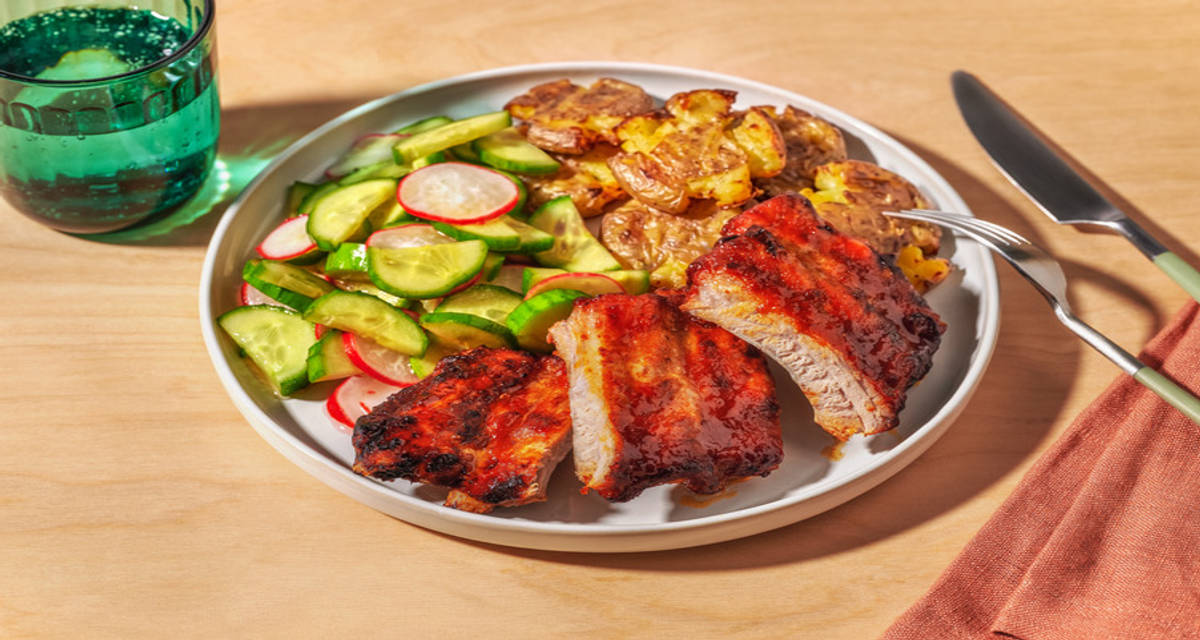 Korean Glazed Pork Ribs and Crispy Smashed Potatoes with cucumber and radish pickle