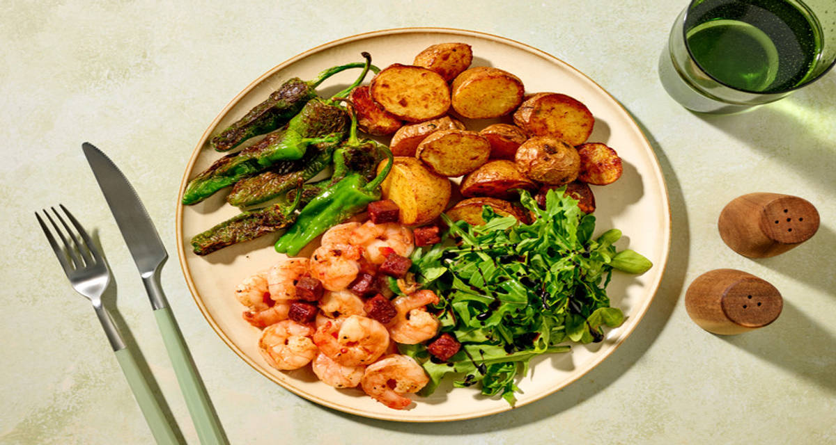 King Prawn Pil Pil with Chorizo with padron peppers and paprika potatoes
