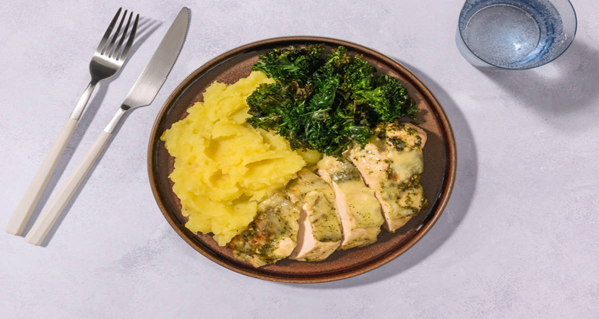 Cheesy Pesto Crusted Double Turkey with garlicky kale chips and mash