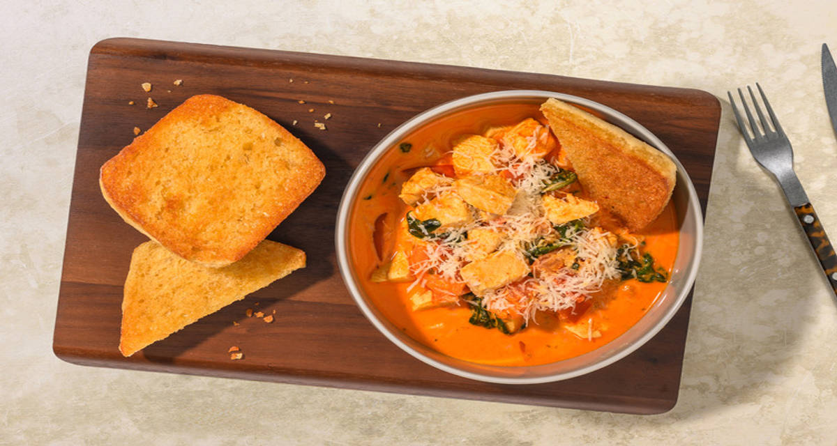 Warming Tuscan Chicken Stew with Chorizo with ciabatta and cheese