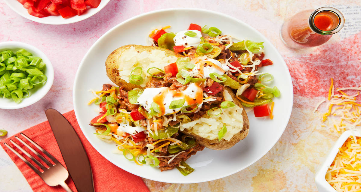 Beef Taco Loaded Potatoes with Peppers, Tomato, and Sour Cream