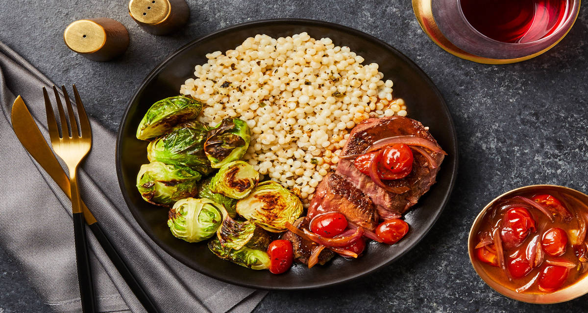 Beef Tenderloin & Balsamic Tomatoes with Garlic Herb Couscous & Roasted Brussels Sprouts