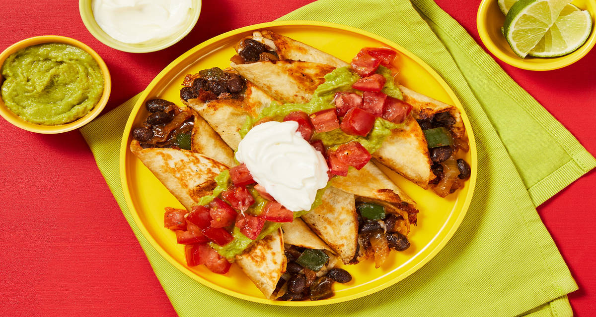 Chicken, Black Bean & Poblano Flautas with Guacamole, Tomatoes & Sour Cream