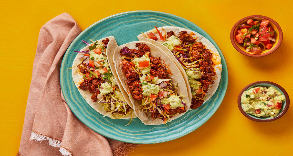 Bold ‘n’ Beefy Tacos with Tangy Slaw, Pico, & Guacamole Cream