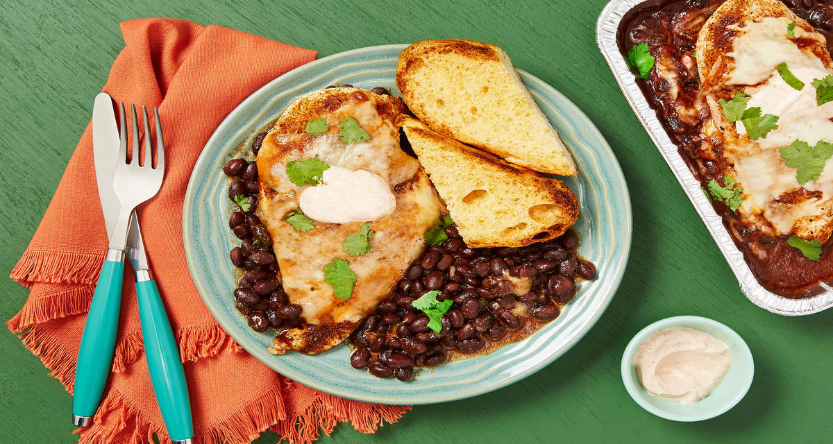 Cheesy Chicken & Spiced Black Beans with Cilantro, Smoky Red Pepper Crema & Garlic Bread