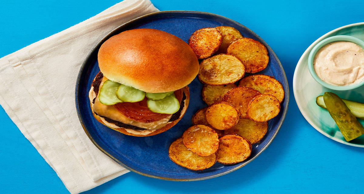 Cheesy Pub Burgers with Griddled Onion, Chipotle Sauce, & Potato Rounds