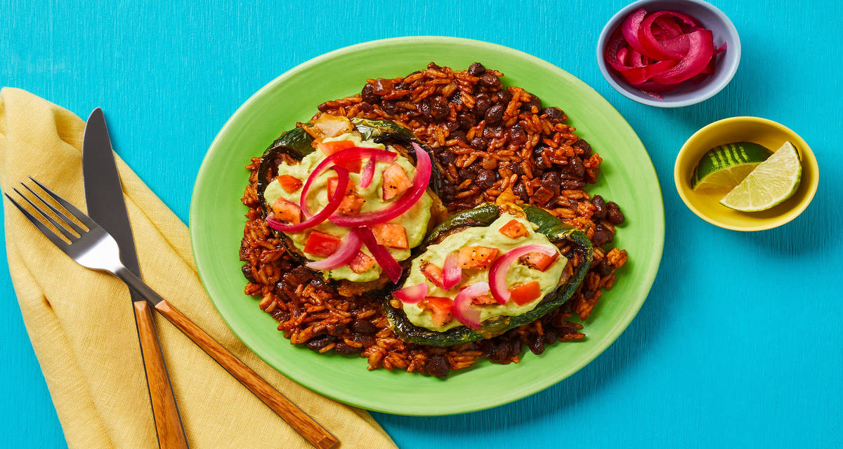 Cheesy Tex-Mex Stuffed Peppers with Rice, Black Beans, Pickled Red Onion & Creamy Guac