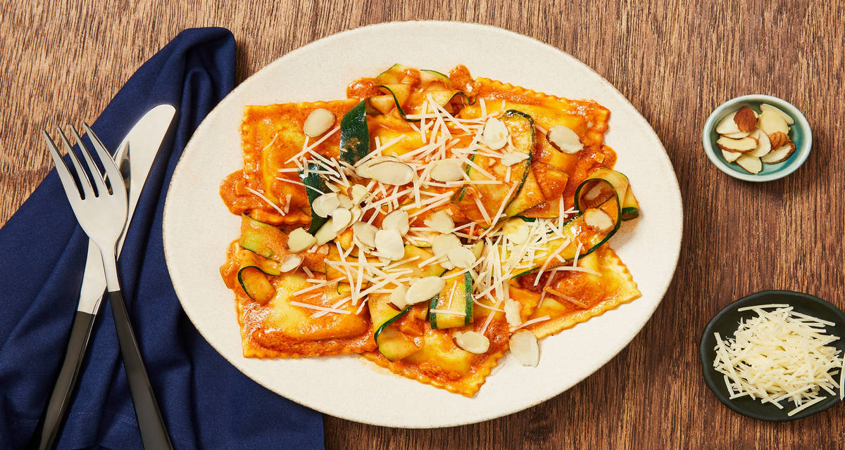 Chicken Romesco Ravioli in a Creamy Tomato Paprika Sauce with Zucchini Ribbons & Almonds