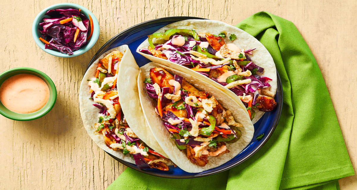 Chicken Stir-Fry Tacos with Tangy Cabbage Slaw, Green Pepper, Sriracha Mayo & Crispy Fried Onions