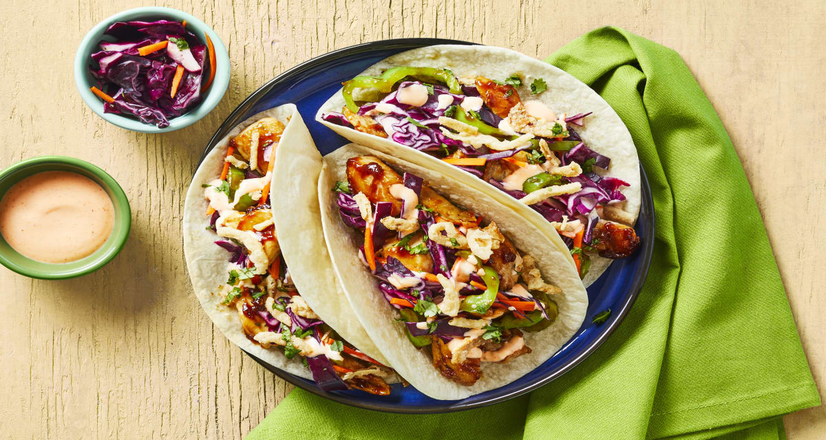Chicken Stir-Fry Tacos With Tangy Cabbage Slaw, Green Pepper, Sriracha Mayo & Crispy Fried Onions-image