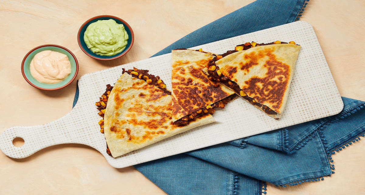 Corn & Refried Bean Quesadillas with Creamy Guac & Smoky Crema