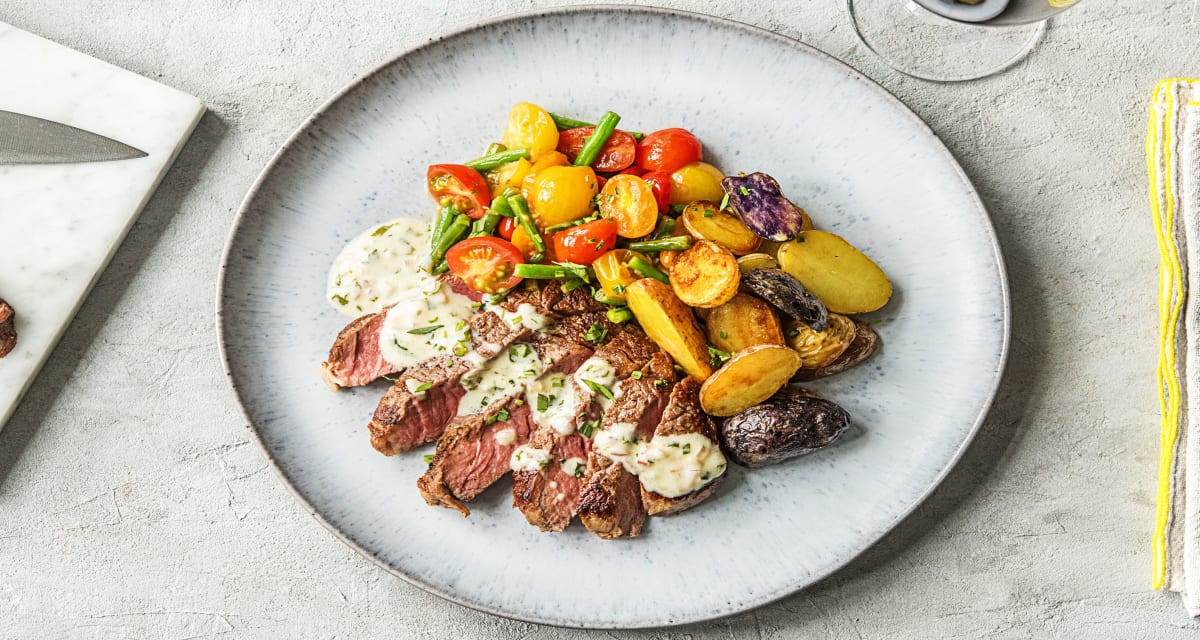 Creamy Bearnaise Rib-Eye Steak with Fingerling Potatoes, Sauteed Green Beans, and Tomatoes-image