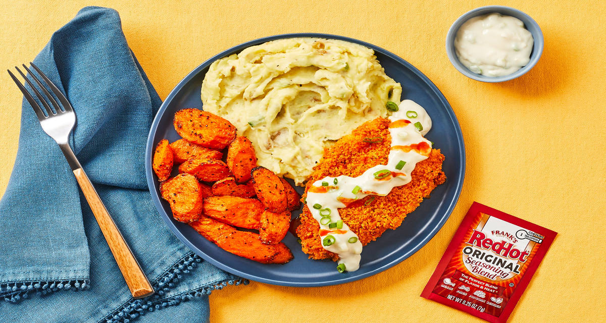 Crispy Frank’s RedHot®-Spiced Chicken with Blue Cheese Sauce, Scallion Mashed Potatoes & Carrots