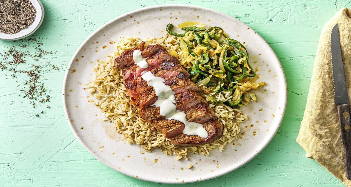 Cuban-Spiced Steak with Poblano Peppers, Rice, and Garlic Lime Crema-image