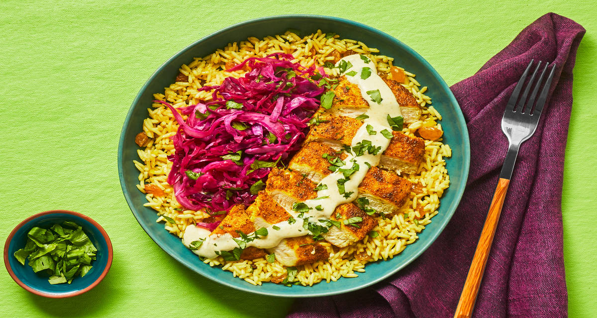 Curried Chicken with Golden Raisin Rice, Pickled Cabbage & Lemon Curry Sauce