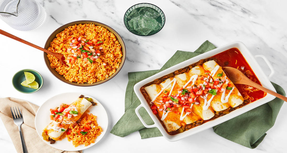 David Burtka’s Cheesy Chicken & Bean Enchiladas with Tomato Rice, Pico de Gallo & Lime Crema