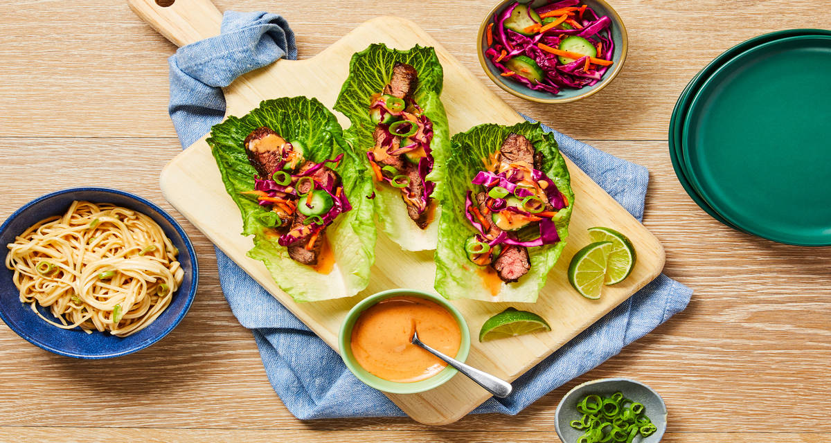 Family-Style Grilled Steak Lettuce Wraps with Pickled Veggies, Creamy Gochujang Sauce & Cold Peanut Noodles