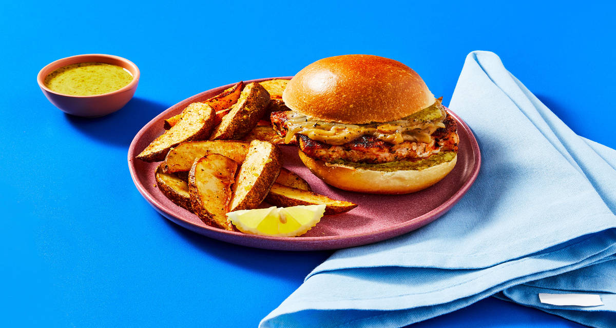 Herbed Pork Chop Sandwiches with Saucy Onion, Lemony Potato Wedges & Creamy Pesto Sauce