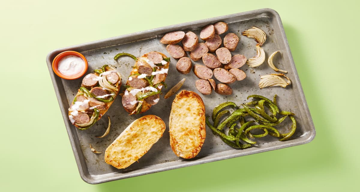 Open-Faced Pork Sausage Sandwiches on Cheesy Garlic Bread with Green Bell Peppers & Onion-image