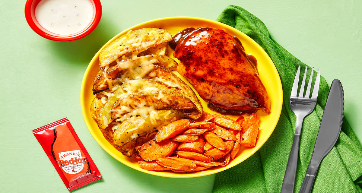 Honey Frank's RedHot® Sauce Chicken with Roasted Carrots & Cheesy Garlic Potato Wedges