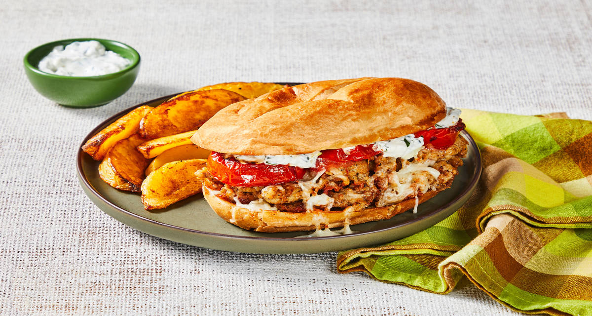 Mighty Mozz Chicken Sausage Melts with Griddled Tomato, Creamy Lemon Herb Sauce & Garlic Potato Wedges