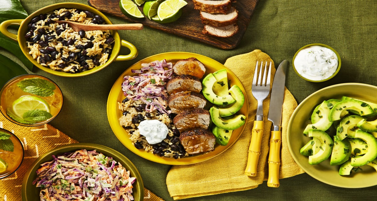 Mojo Pork Tenderloin with Arroz Congri, Creamy Cilantro Slaw, and Avocado Salad-image