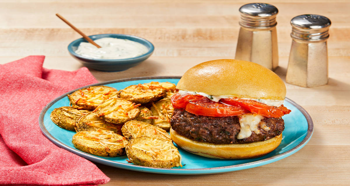 Mozz-Stuffed Caprese Burgers with Griddled Tomato, Basil Sauce & Parmesan Potato Rounds
