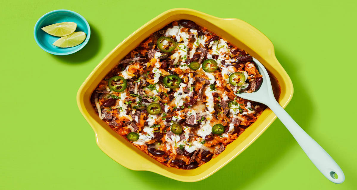 One-Pan Rice & Bean Enchilada Bake with Pickled Jalapeño, Zesty Crema & Blue Corn Tortilla Chips