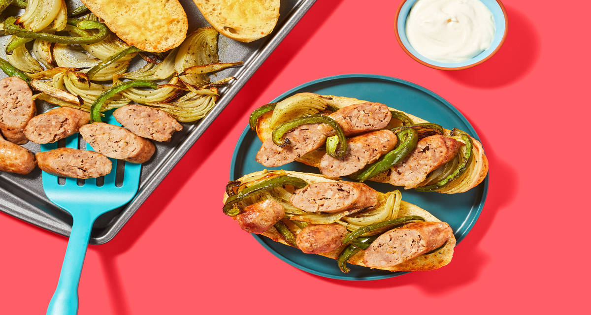 Open-Faced Pork Sausage Sandwiches on Cheesy Garlic Bread with Green Bell Peppers & Onion