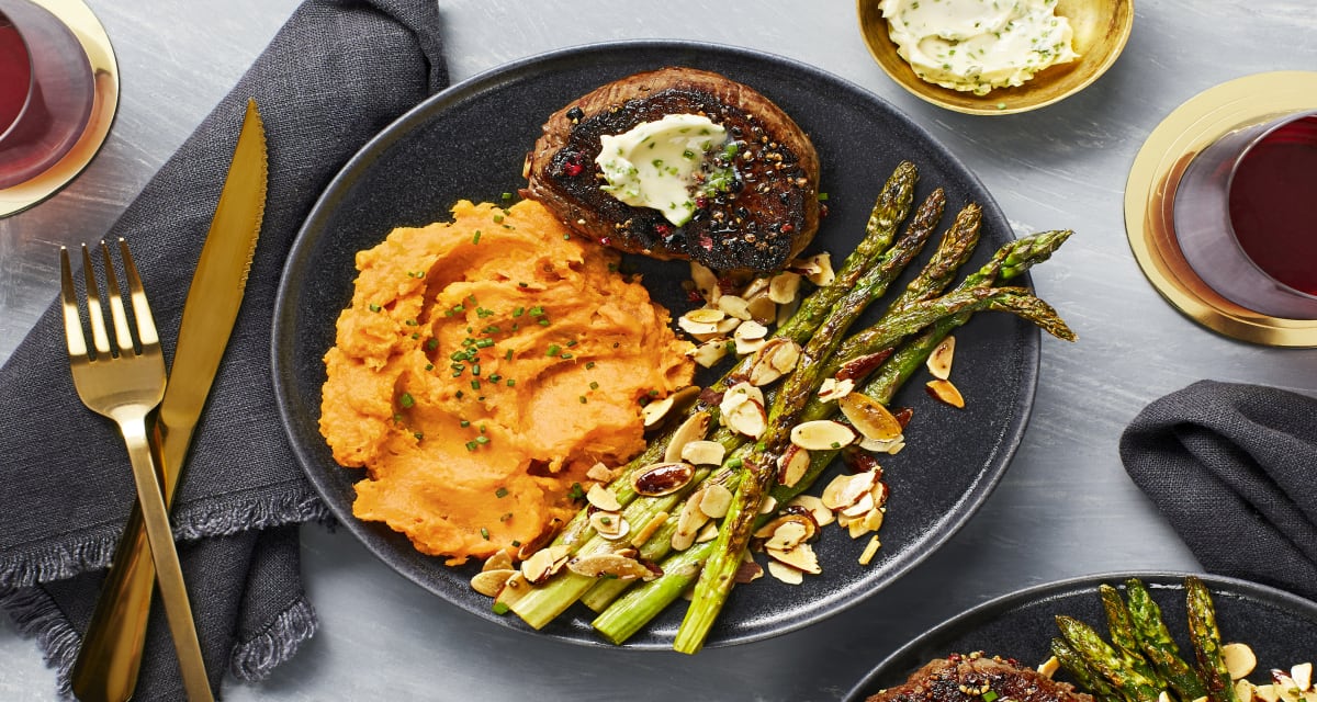 Peppercorn-Crusted Beef Tenderloin With Chive Butter, Asparagus Amandine & Mashed Sweet Potatoes-image