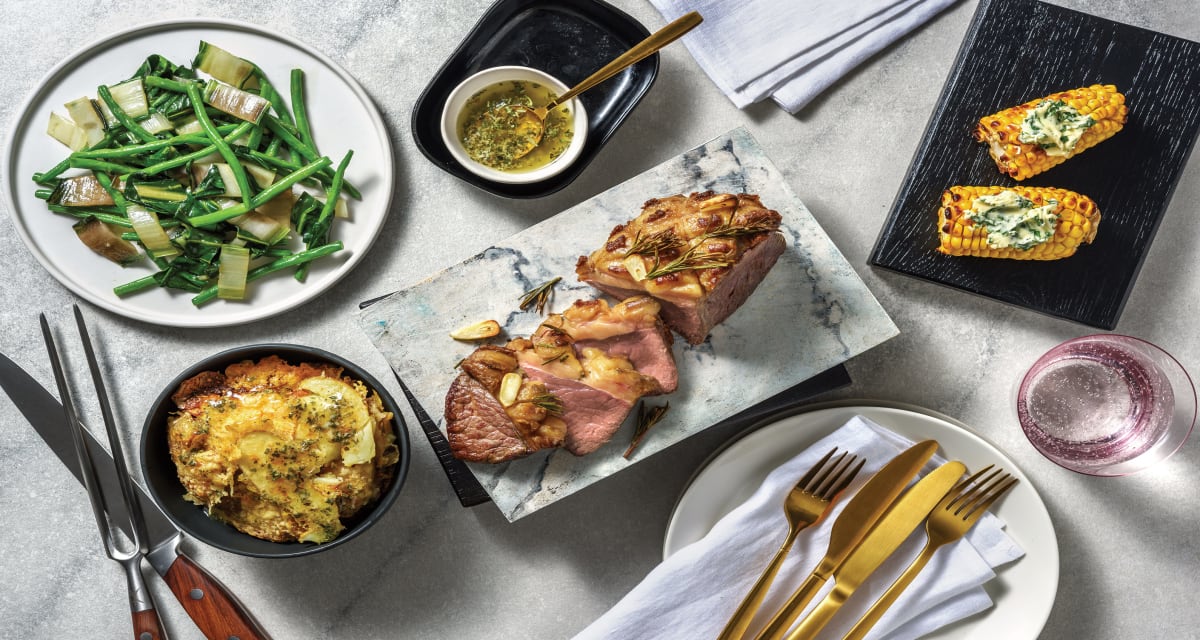 Rosemary Garlic Lamb & Mint Sauce with Cheesy Chat Potatoes, Garlic Greens & Corn Cobs-image