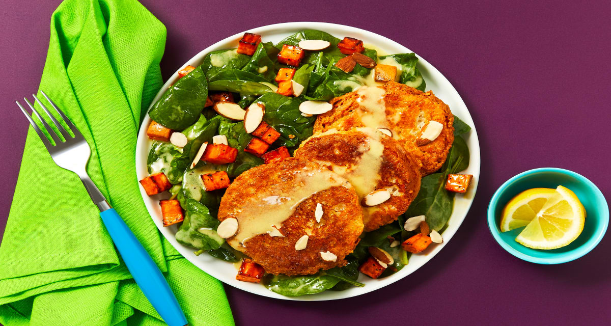 Savory Ricotta Fritters over a Spinach & Roasted Sweet Potato Salad-image