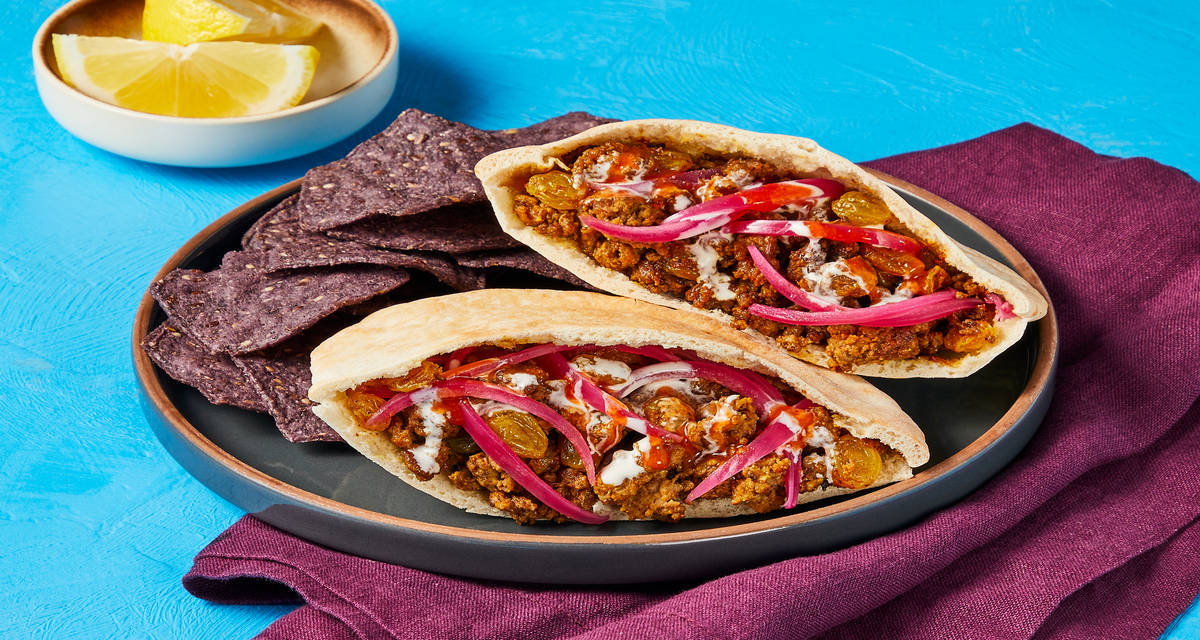 Shawarma-Spiced Beef & Golden Raisin Pitas with Pickled Onion & Lemony White Sauce