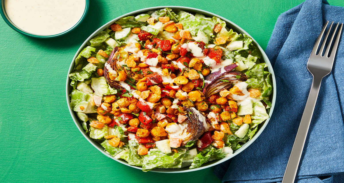 Smashed Chickpea Chopped Salad with Roasted Red Onion, Dried Apricots & Creamy Greek Dressing
