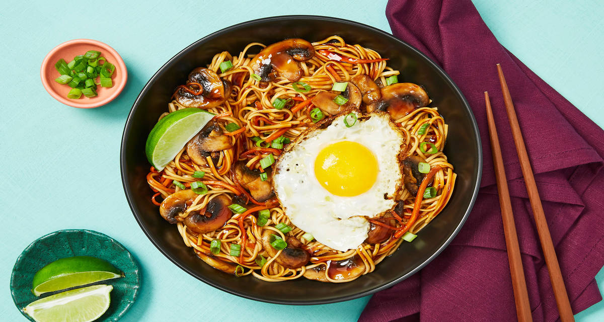 Szechuan Noodles with Mushrooms & Carrot topped with a Fried Egg