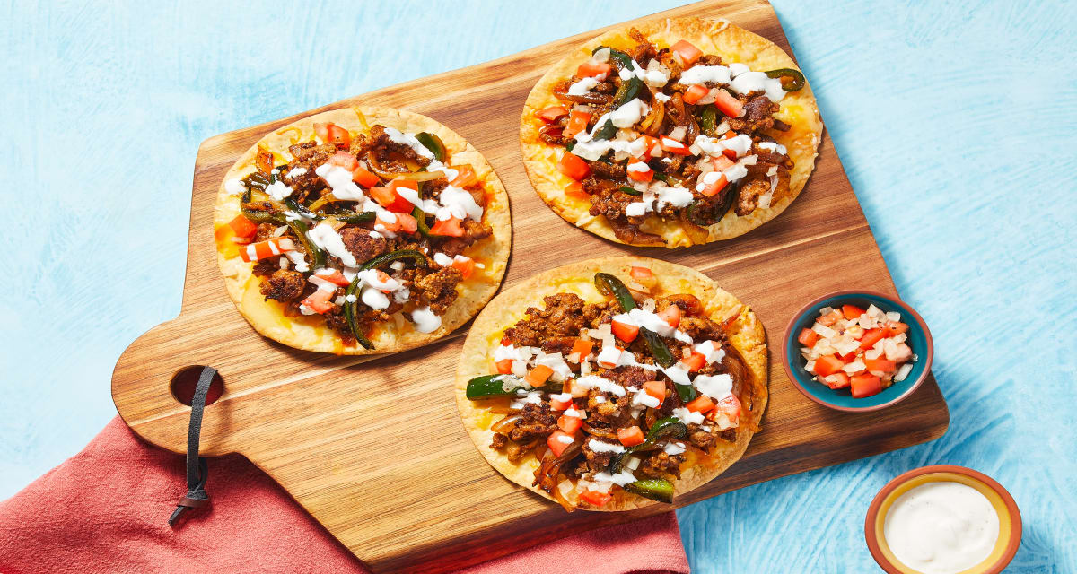 Tostadas Supremo with Pork plus Poblano, Lime Crema & Pico de Gallo-image