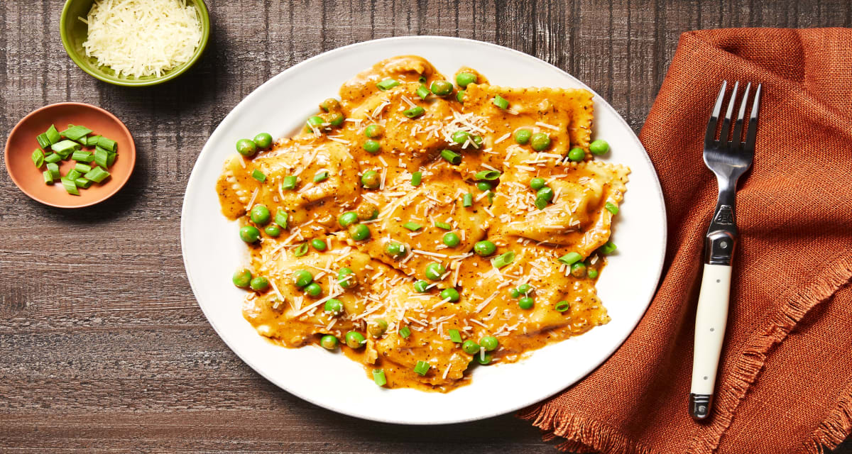Tuscan Chicken & Bacon Filled Ravioli with Peas & a Tomato Parmesan Cream Sauce-image