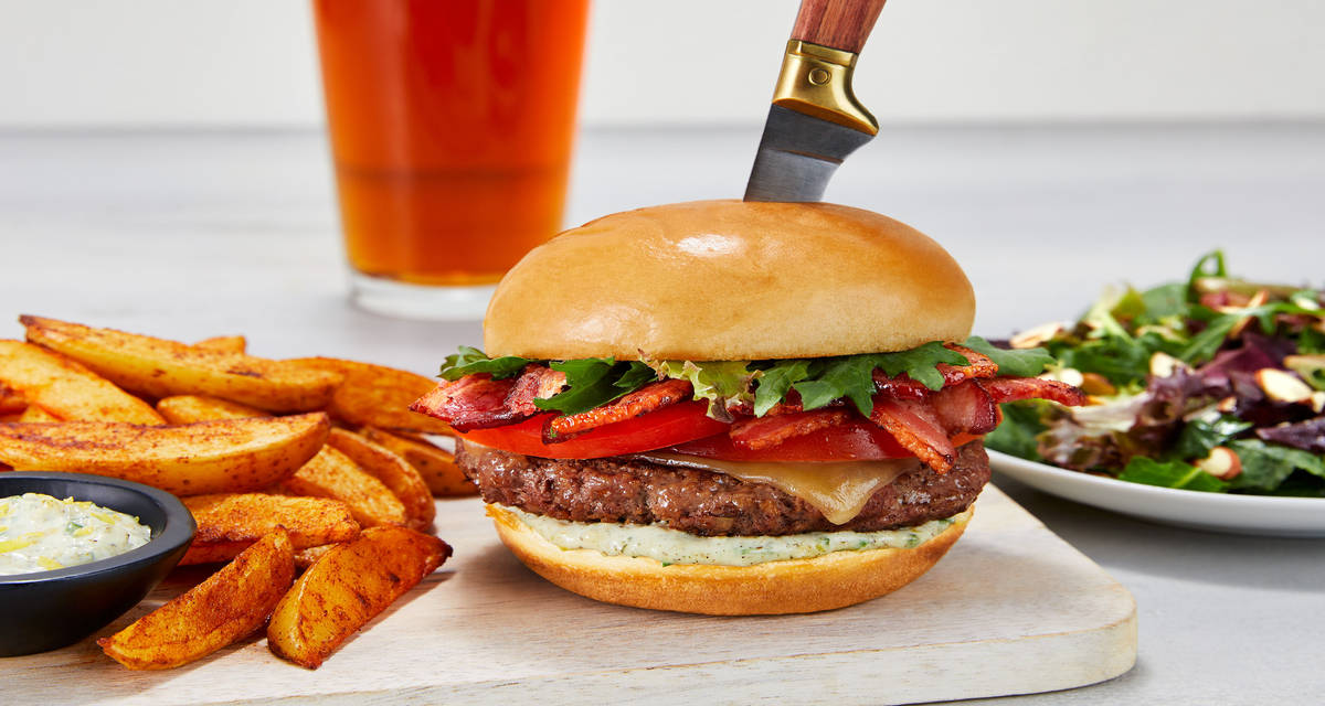 Ultimate BLT Burgers with Herby Aioli plus Potato Wedges & Caesar-Dressed Greens with Toasty Almonds