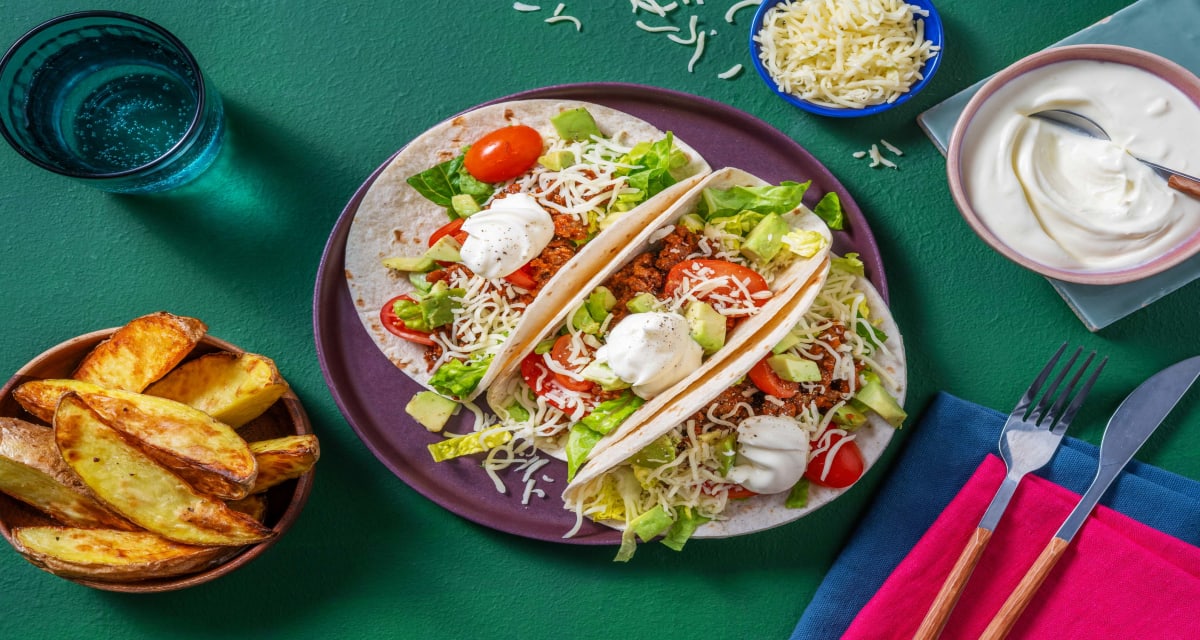 Ultimate Tex-Mex Style Chipotle Beef Tacos with Wedges, Avocado Salsa, Cheese and Creme Fraiche-image
