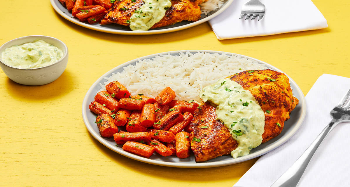 Yogurt-Marinated Curried Chicken with Garlic Basmati Rice, Roasted Carrots & Cucumber Cilantro Raita