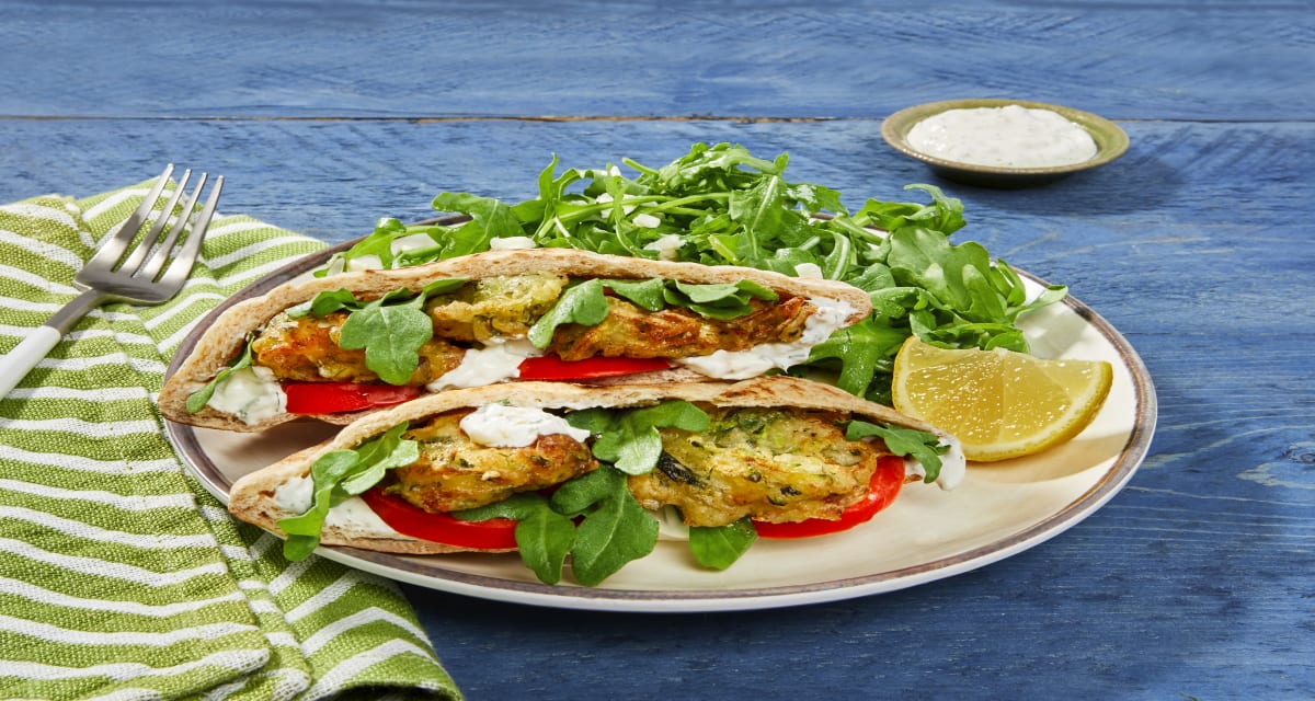 Zucchini & Feta Fritter Pita Pockets with Feta, Creamy Dill Sauce & Arugula Salad-image