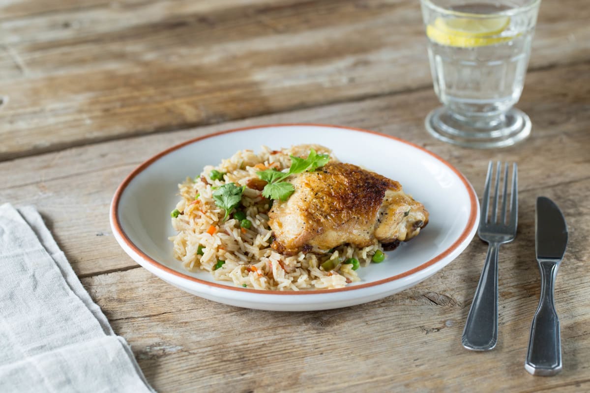 Crispy Chicken Biryani with Spiced Basmati Rice, Golden Raisins, and Peas