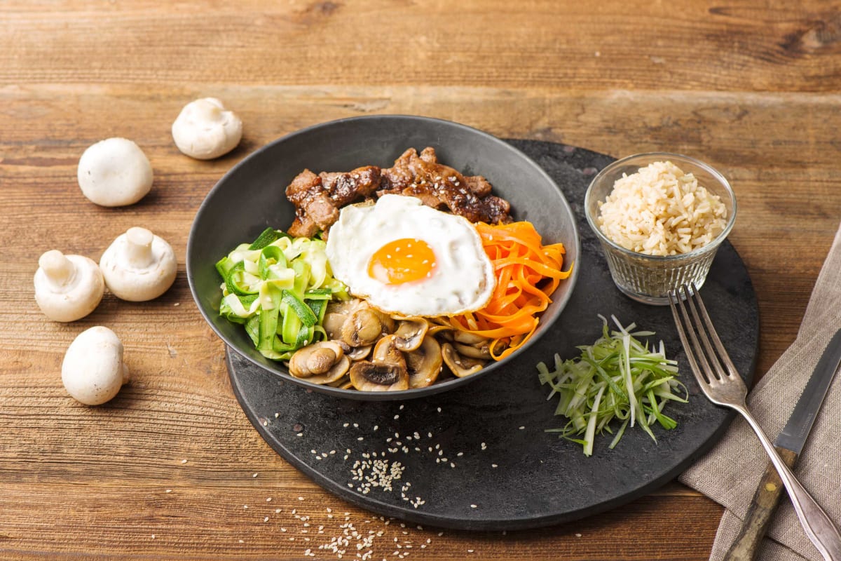 Marinated Steak Bibimbap with Shaved Vegetables, Crispy Mushrooms, and Pickled Scallions