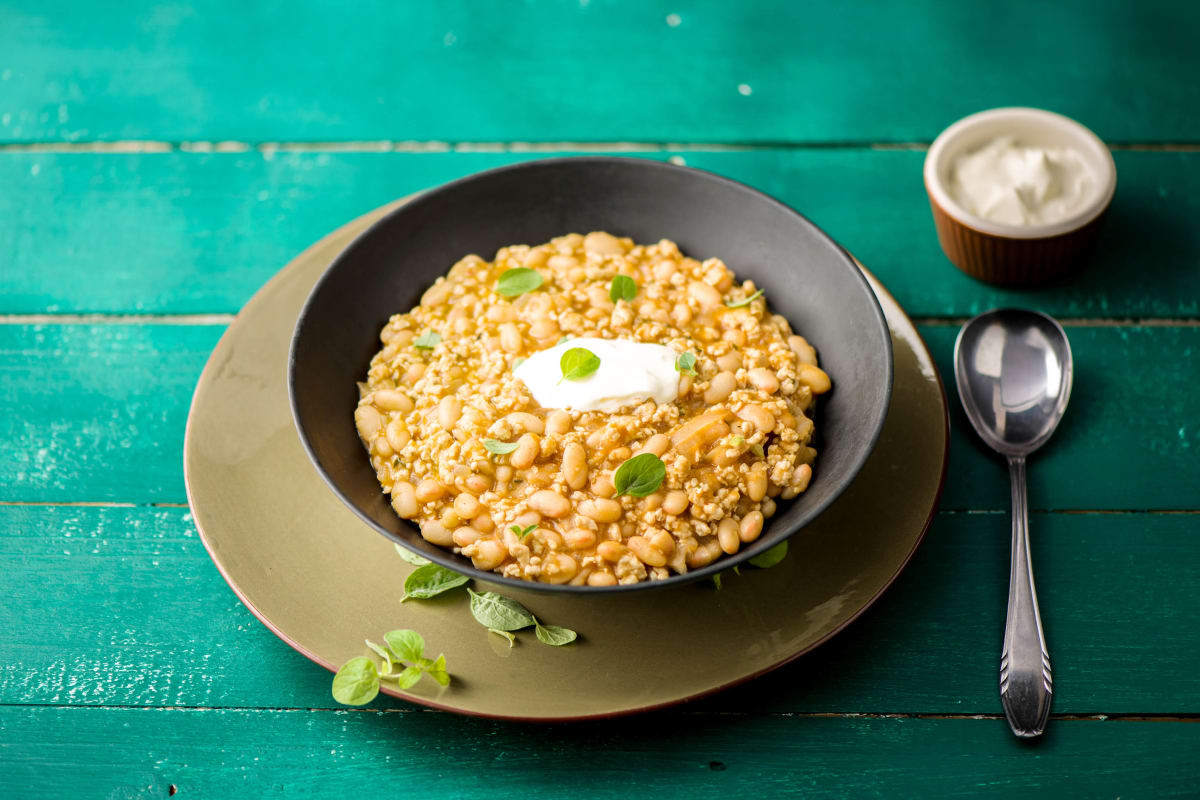 Smoky Turkey and White Bean Chili with Rosemary, Oregano, and Sour Cream