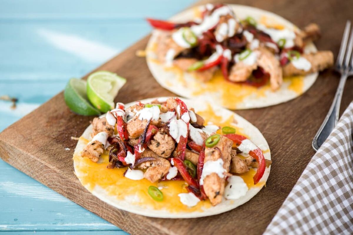 Smoky Chicken Fajitas with Charred Pepper and Onion, Garlic-Lime Crema, and Quick-Pickled Jalapeno